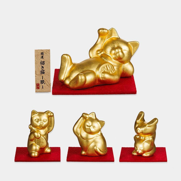 Gold maneki neko lucky cat figurines with Kanazawa gold leaf finish on red bases | Ishikawa, Hakuichi