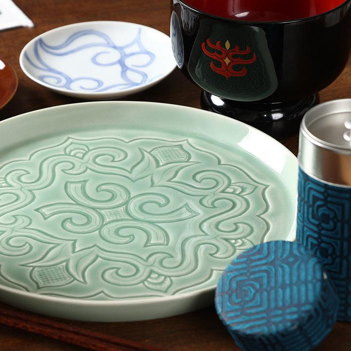 Ainu lacquerware bowl in table setting with celadon plate and cylindrical cup with blue patterned sleeve | CIKARPE AKAN, Hokkaido