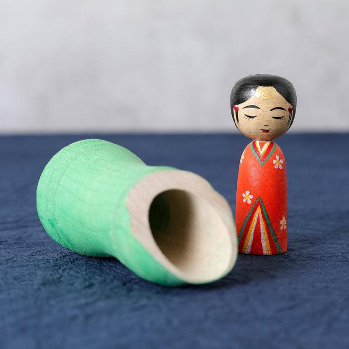 Princess Kaguya kokeshi wooden doll with green bamboo case, hand-painted in red kimono | Tsuchiyu, Fukushima, Akihiro Konno