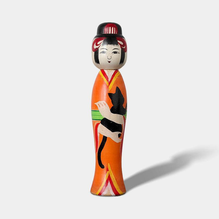 Taisho-style kokeshi wooden doll in orange kimono holding a black cat | Tsuchiyu, Fukushima, Konno Akihiro