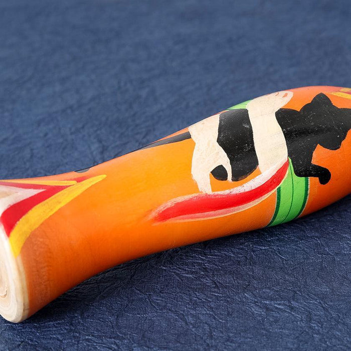 Taisho-style Tsuchiyu Kokeshi wooden doll in orange with bold hand-painted design | Fukushima, Konno Akihiro