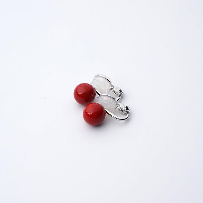 Clip-on earrings for both ears.