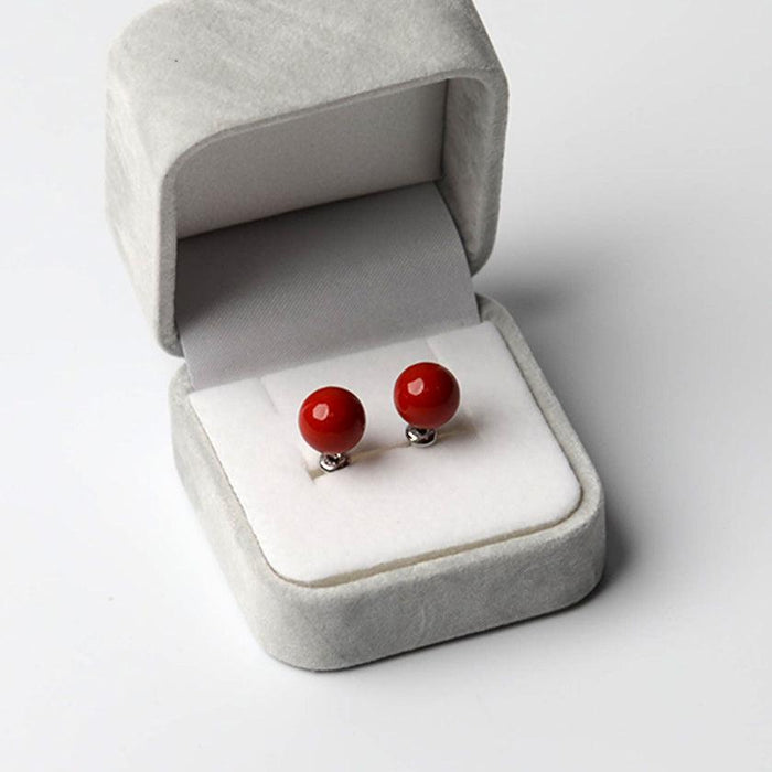 Clip-on earrings for both ears.