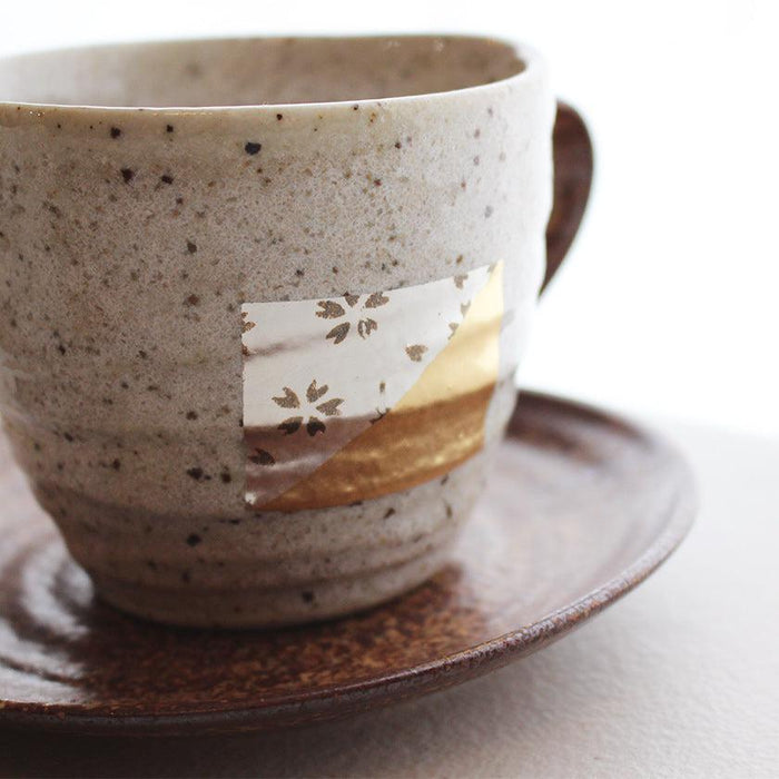 Stoneware coffee cup and saucer with gold leaf sakura motif | Kanazawa gold leaf, HAKUICHI