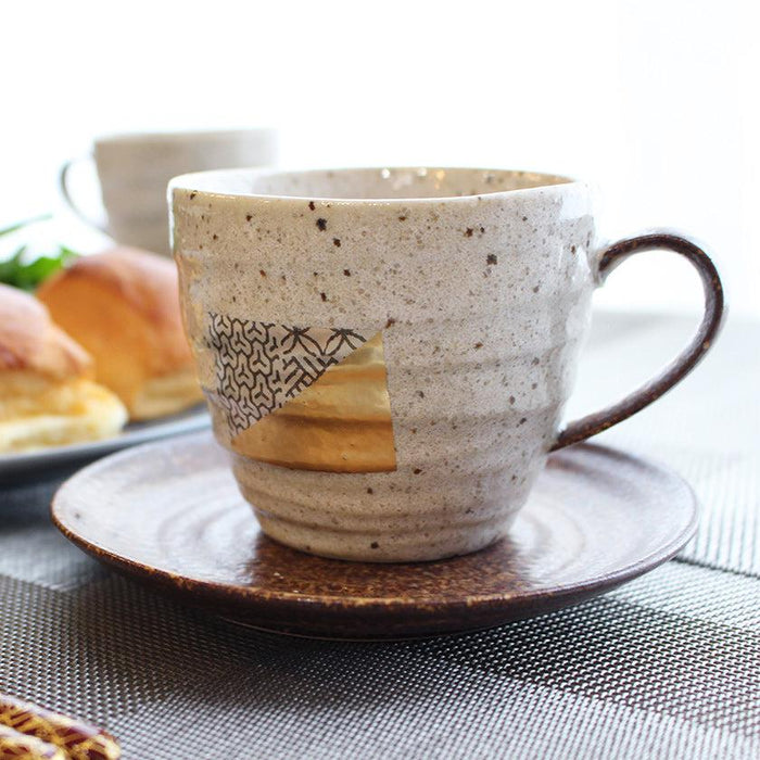 Stoneware coffee cup and saucer with Kanazawa gold leaf accent on speckled glaze | HAKUICHI, Japan