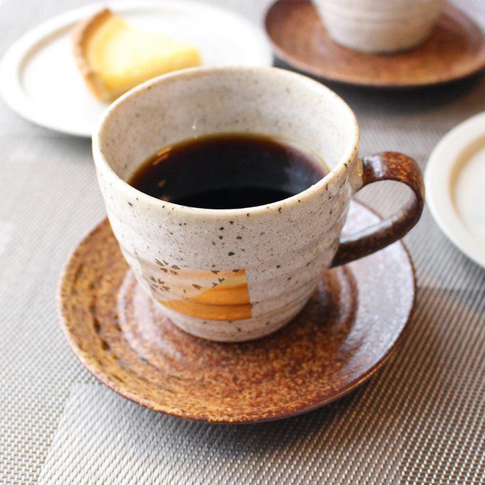 Kanazawa gold leaf ceramic coffee cup and saucer set with black coffee, table setting | HAKUICHI, Kanazawa