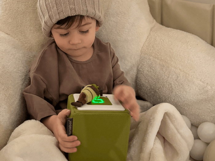 Child Playing With Shrek Tonie