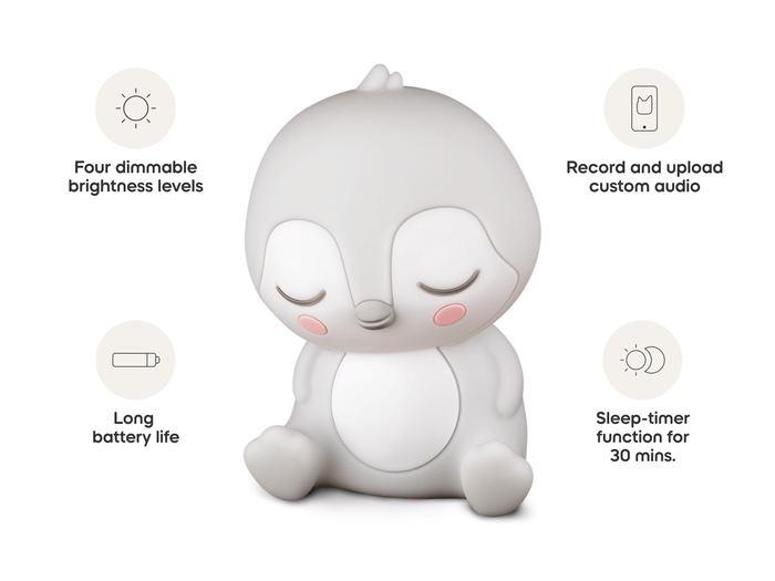 Child playing with Sleepy Friends Sleepy Penguin Night Light audio figurine and Toniebox 2