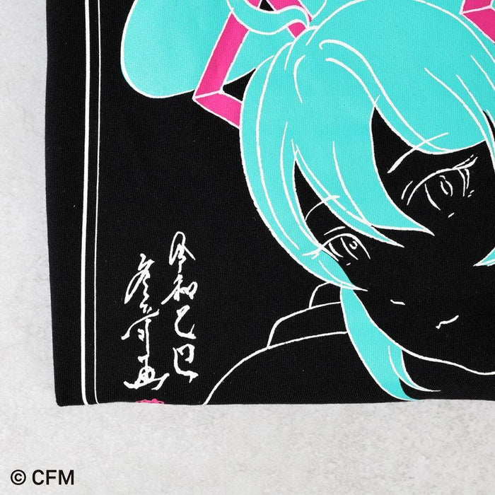 Black hand-printed Hatsune Miku graphic T-shirt detail with teal twintails and Japanese calligraphy signature | Hatsune Koubou