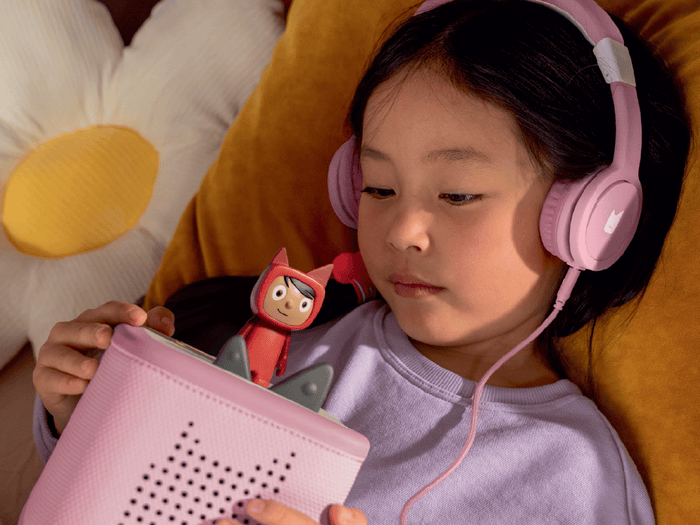 Child Listening To The Toniebox 2 And Tonie With Pinkwired Headphones For Kids